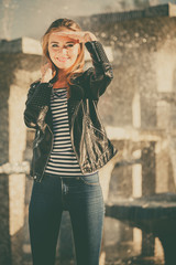 Fototapeta premium woman casual style posing against city fountain