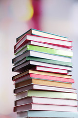 Stack of books on bright background