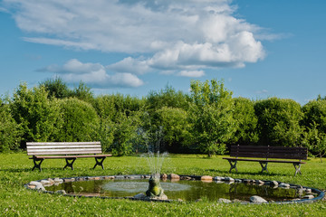 bench near the fountain in the garden