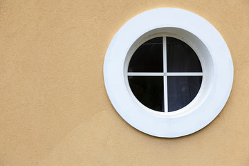 Circle white window on the texture wall. No shadow.