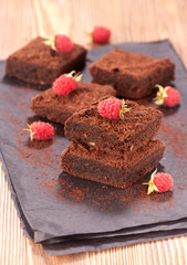 Cake chocolate brownies and raspberries