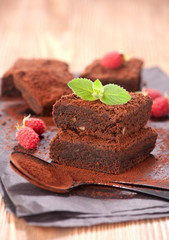 Cake chocolate brownies and raspberries