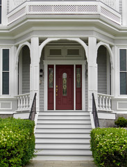 white wooden porch and front steps of house