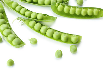 Fresh green peas isolated on white