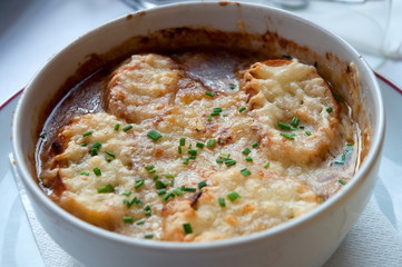 French onion soup with cheese .