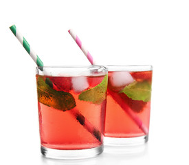 Glasses of strawberry juice isolated on white