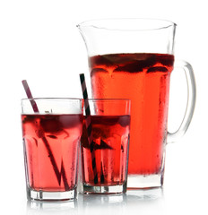Full jug and glasses of strawberry juice isolated on white