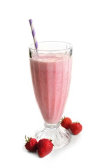 Glass of milkshake with strawberries isolated on white