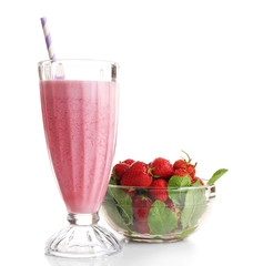 Glass of milkshake with strawberries isolated on white