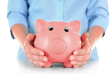 Woman holding piggy bank close up