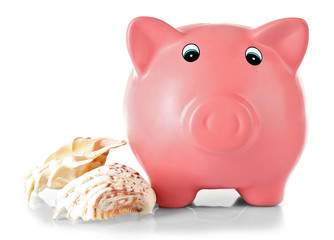 Piggy bank with shells isolated on white