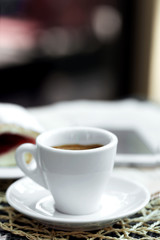 Cup of cappuccino on table in cafe