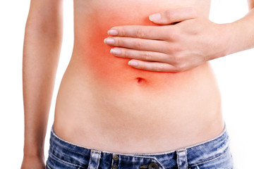 Young girl with abdominal pain close up