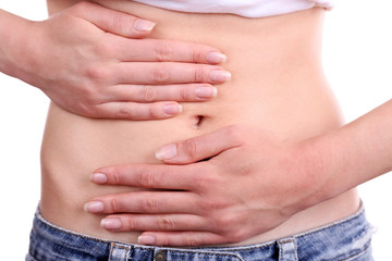 Fototapeta premium Woman's hands on abdomen stomach pain and digestive health menstrual cramps and bloating relief isolated on white background