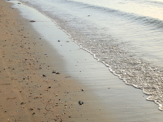 Wave of the sea on the sand beach