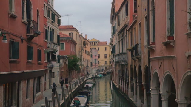Water Canal and Sidewalk Surrounded with Houses in Venice, Italy