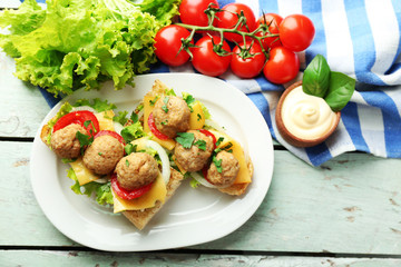 Meatball Sandwiches on wooden table background