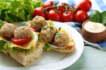 Meatball Sandwiches on wooden table background