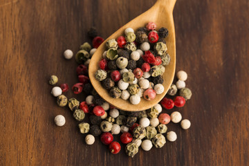 Mixed green, red, white and black peppercorns