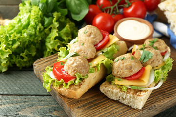 Meatball Sandwiches on wooden table background