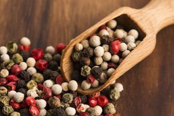 Mixed green, red, white and black peppercorns
