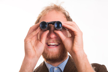 Excited man watching through binoculars