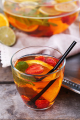 Fruity punch in glassware on metal tray, closeup