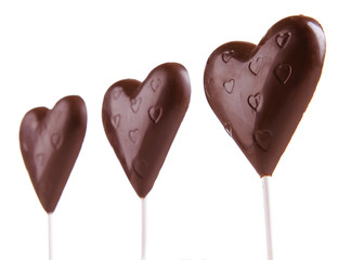 Chocolate candies in shape of hearts isolated on white