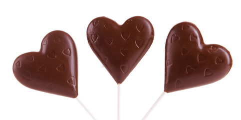 Chocolate candies in shape of hearts isolated on white