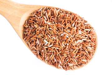 Fototapeta na wymiar brown rice on wooden spoon isolate on white background.