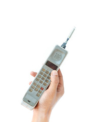 man hand holding vintage mobile phone Isolated on white background.