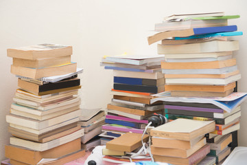 pile old books on table