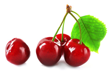 Fresh cherries with leaf isolated on white