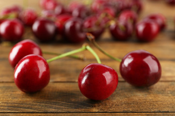 Fresh cherries on wooden table, closeup