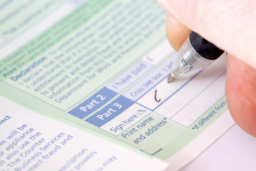 Signing prescription.
Man signing a doctors prescription.