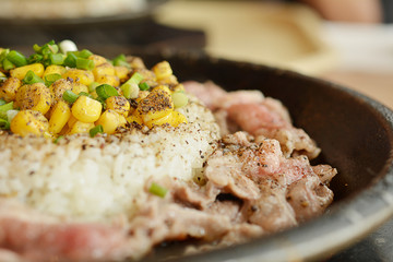 Beef rice on the hot pan, Japan cuisine. rice with honey sauce.