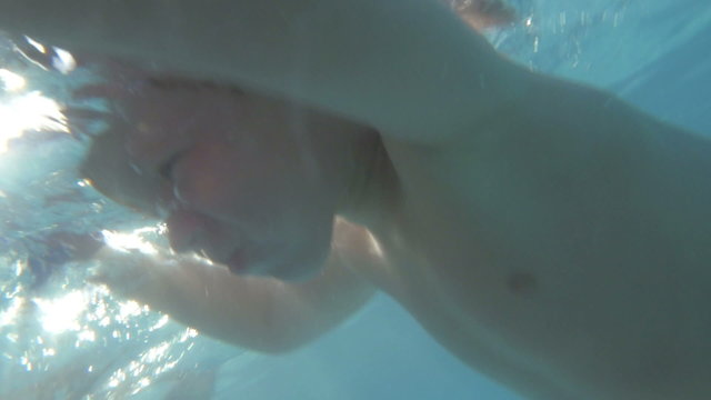 They enjoying swimming and diving in the pool