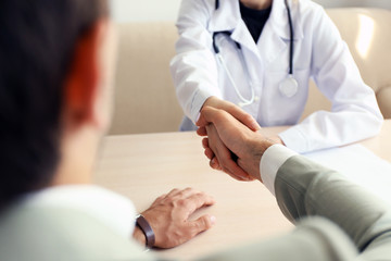 Doctor receiving patient in office