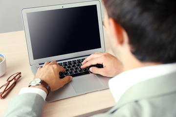 Man working with laptop in office