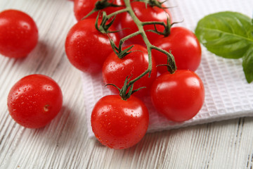 Cherry tomatoes on wooden table close up