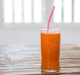 Carrot juice  on  wooden table