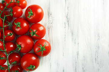 Pile of cherry tomatoes on wooden background