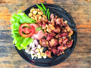 Fermented Chicken Tendons,thai food with wood background,