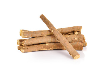Licorice roots on white background.