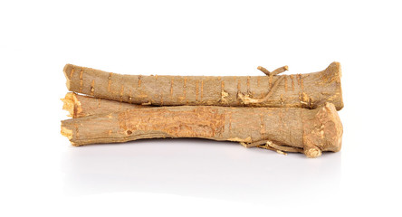 Licorice roots on white background.