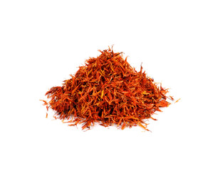 Safflower petals in a spoon on white background