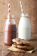 Fresh milk with drinking straw and cookies
