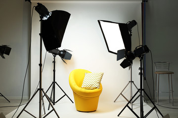 Photo studio with modern interior and lighting equipment