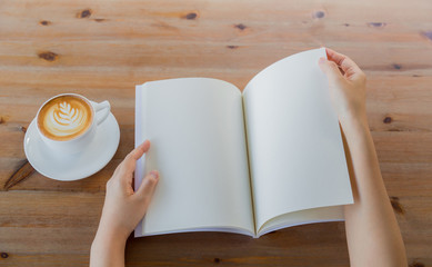 Hands open Blank catalog, magazines,book mock up on wood table w