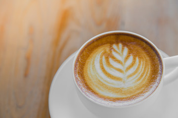 Latte Coffee art on the wooden table